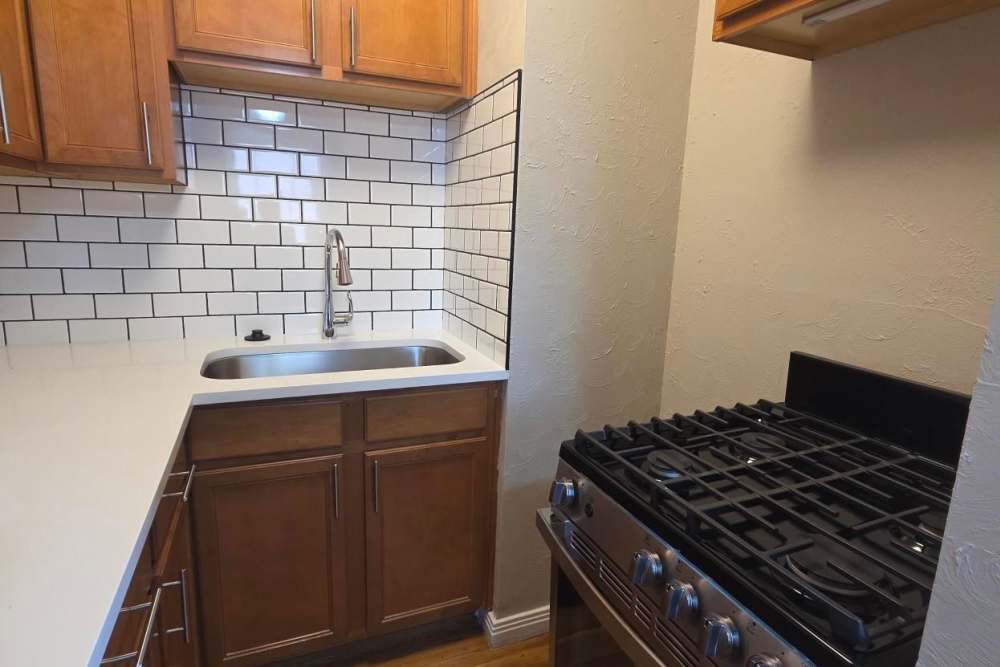 Kitchen with cabinets and gas stove at Cascade Park in Colorado Springs, Colorado