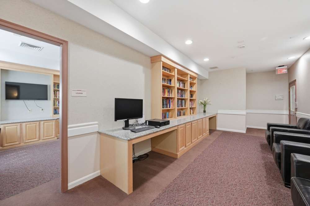 Library with computer at Waverly Gardens in Woodstock, Maryland 