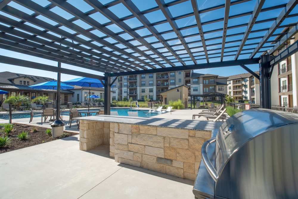 Outdoor grilling station with stainless steel barbeque area 