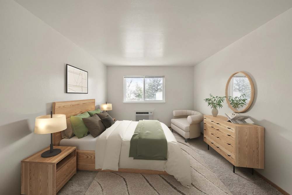 Bedroom with carpet flooring at Patchogue Village at Rider, an Eagle Rock Community in Patchogue, New York
