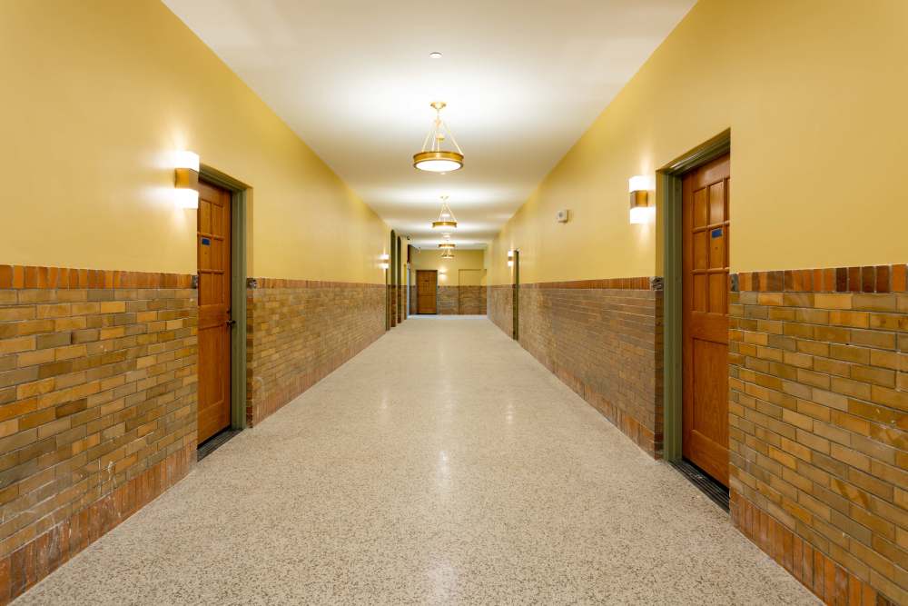 Welcoming hallway with warm lighting at Elias Brookings Apartments in Springfield, Massachusetts