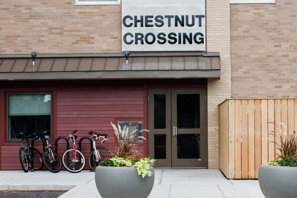 Planters with greenery at entrance to Chestnut Crossing at Chestnut Crossing in Springfield, Massachusetts