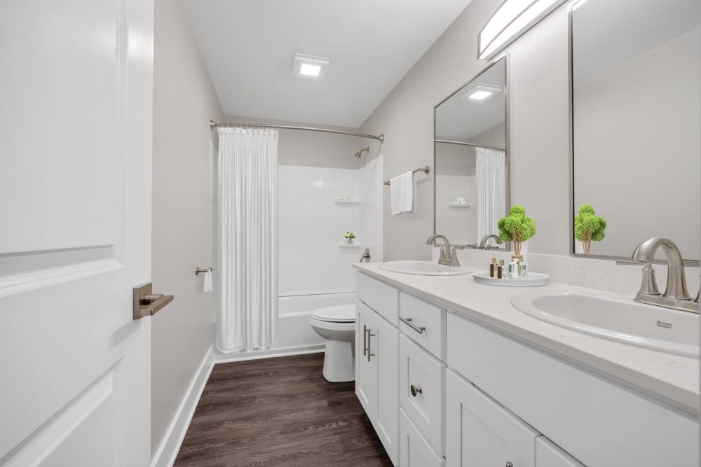 Double vanity with modern fixtures at Valley Brook Townhomes in Rochester, New York