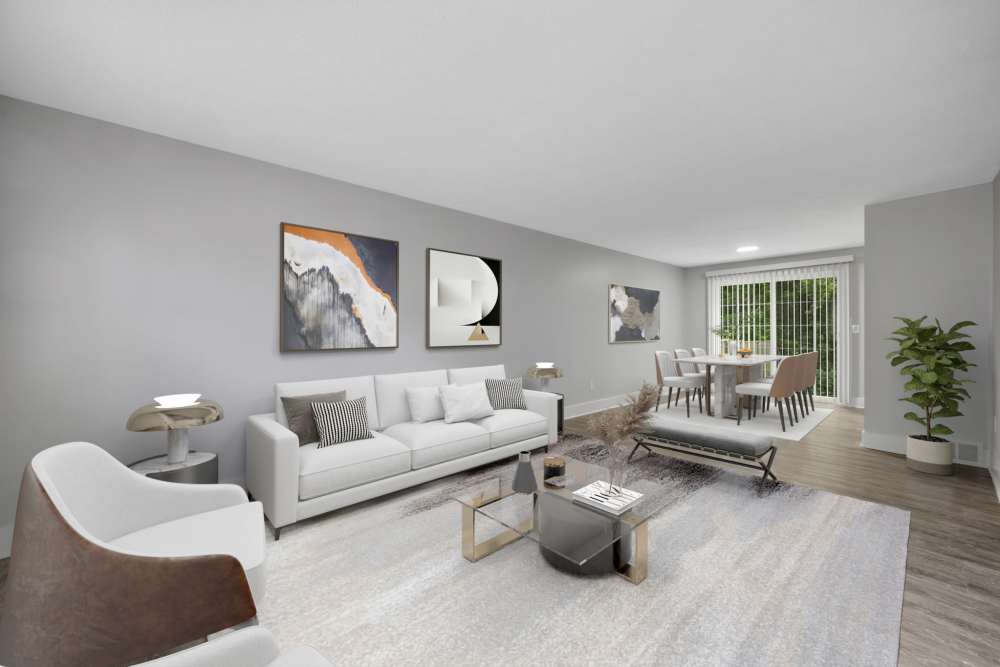 Living room with modern decor and dining area at Valley Brook Townhomes in Rochester, New York