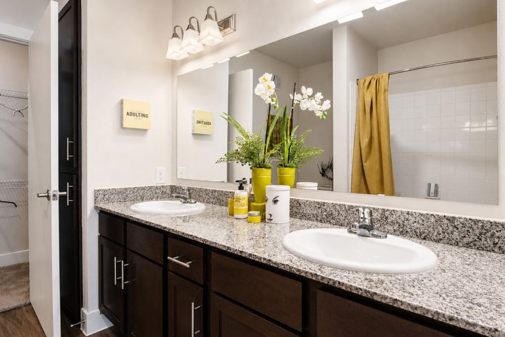 Granite counters in an apartment bathroom at Esperanza in San Antonio, Texas