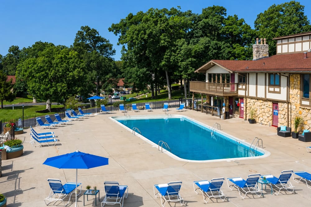Green trees in background with pool area at Castle Point in South Bend, Indiana