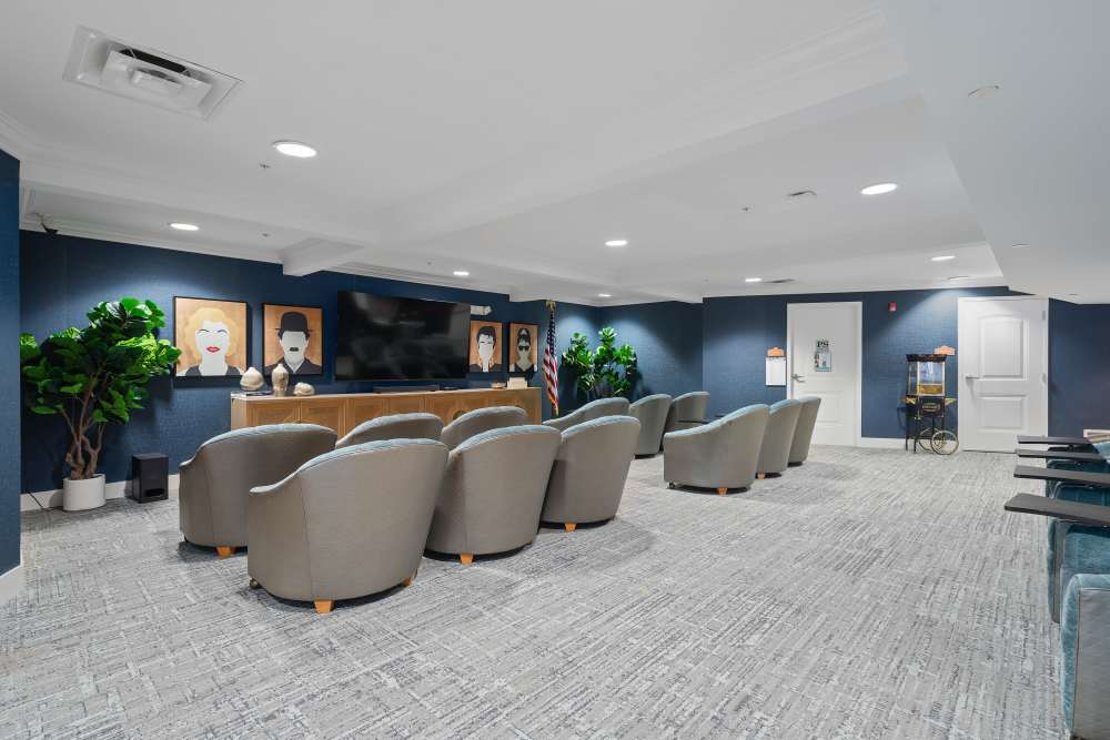Community dining area with modern tables and seating at Gentry Park Orlando in Orlando, Florida