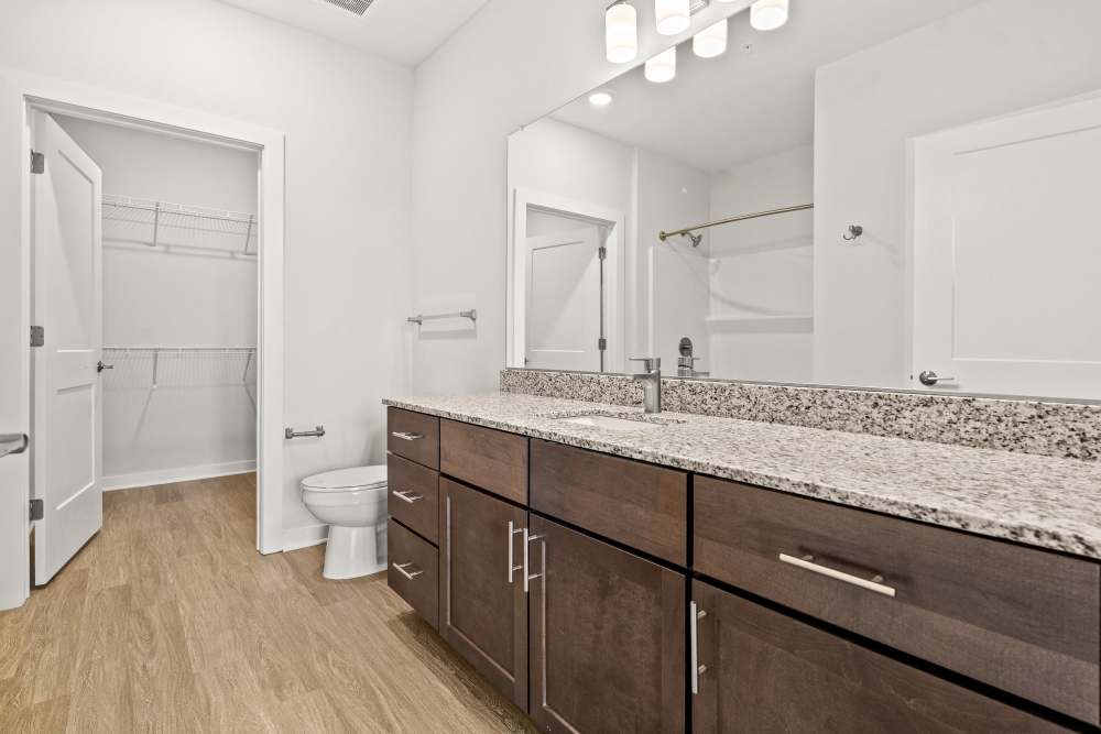 Bathroom featuring dual-sink vanity and contemporary finishes at The Cascade at Foundry Creek in Richmond, Virginia