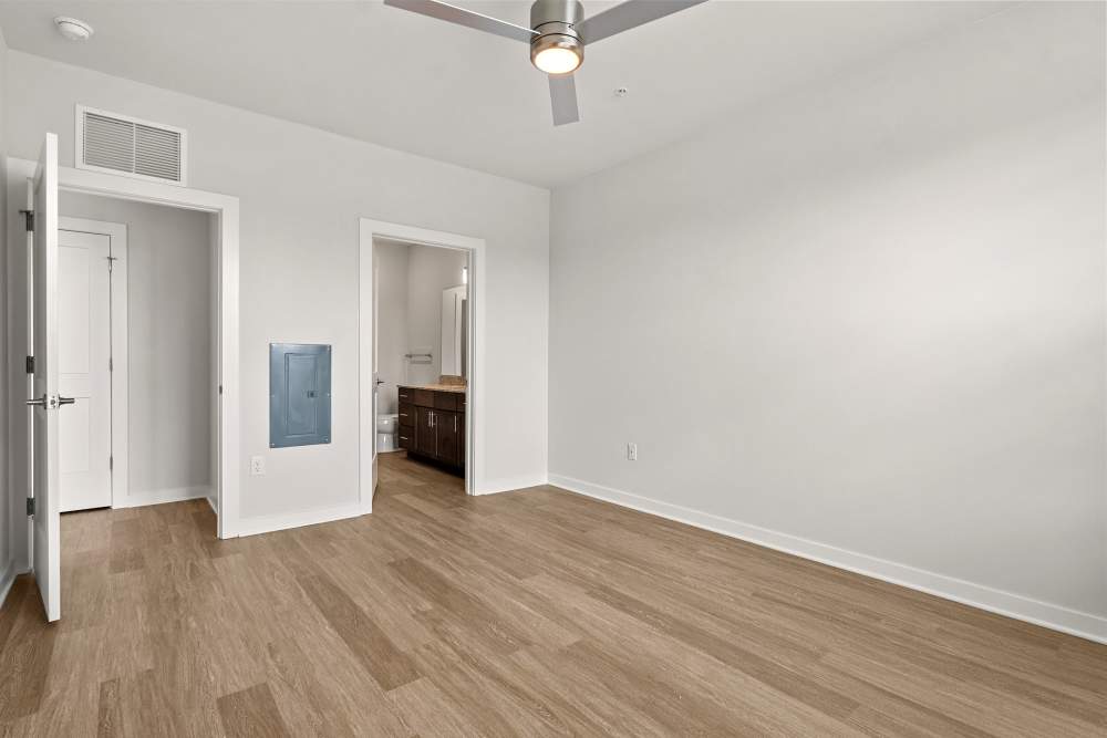 Spacious living room with modern flooring and open layout at The Cascade at Foundry Creek in Richmond, Virginia