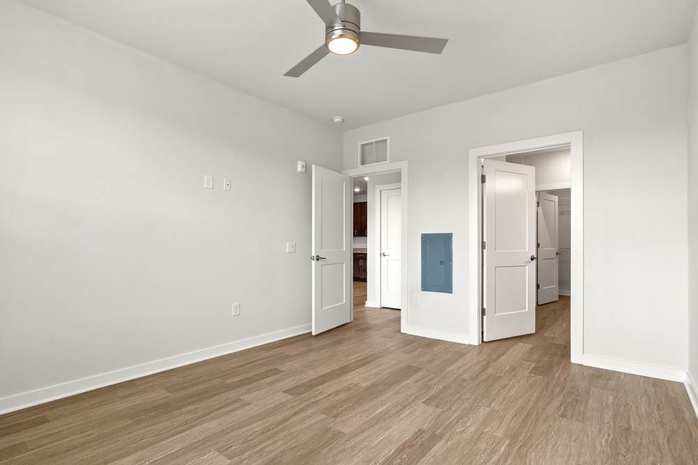 Open-concept living area with wood-style floors and natural light at The Cascade at Foundry Creek in Richmond, Virginia