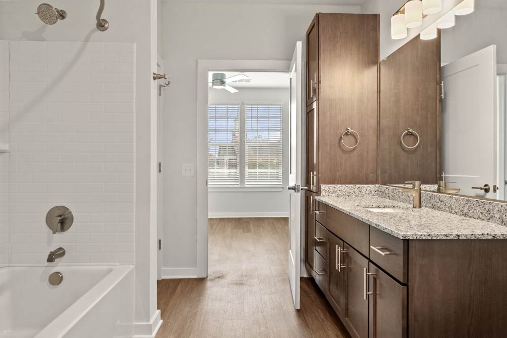 Entryway leading to bathroom and kitchen with modern finishes at The Cascade at Foundry Creek in Richmond, Virginia