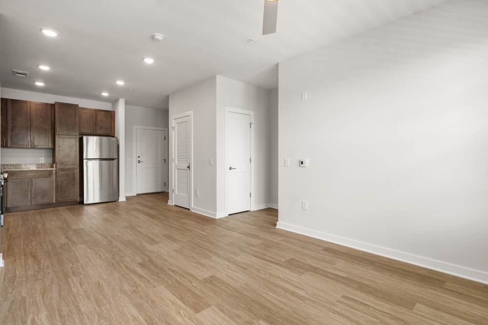 Open living space with recessed lighting and modern flooring at The Cascade at Foundry Creek in Richmond, Virginia