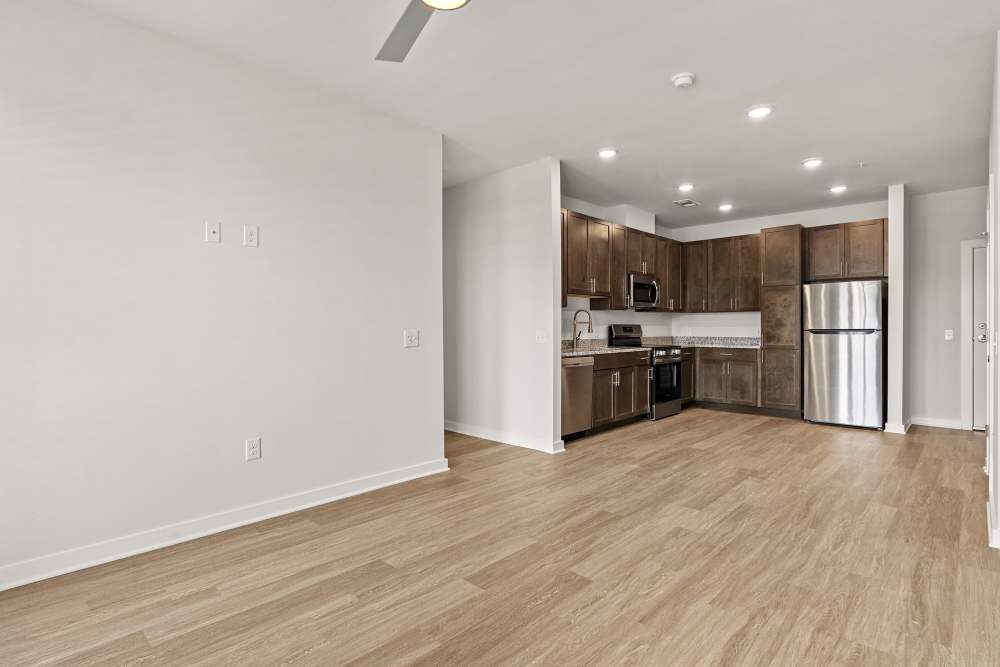 Open floor plan connecting living room and kitchen area at The Cascade at Foundry Creek in Richmond, Virginia