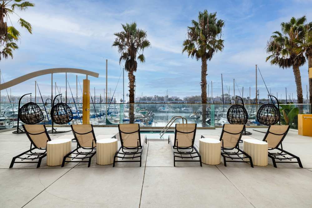 Relaxing lounge area with marina views at St Tropez Apartments in Marina Del Rey, California