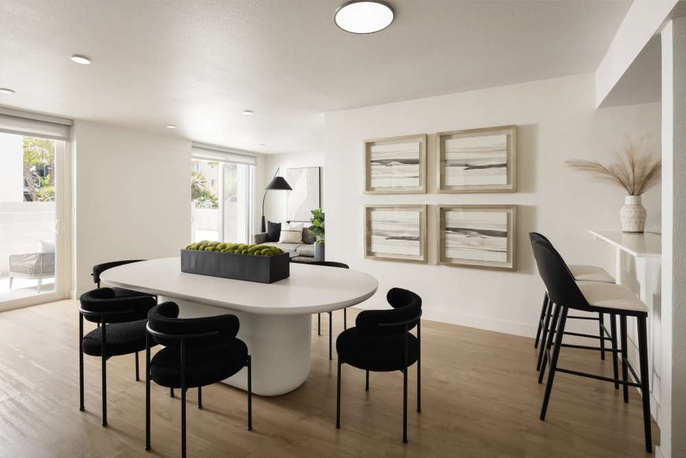Dining room table and chairs with bar stools at bar area