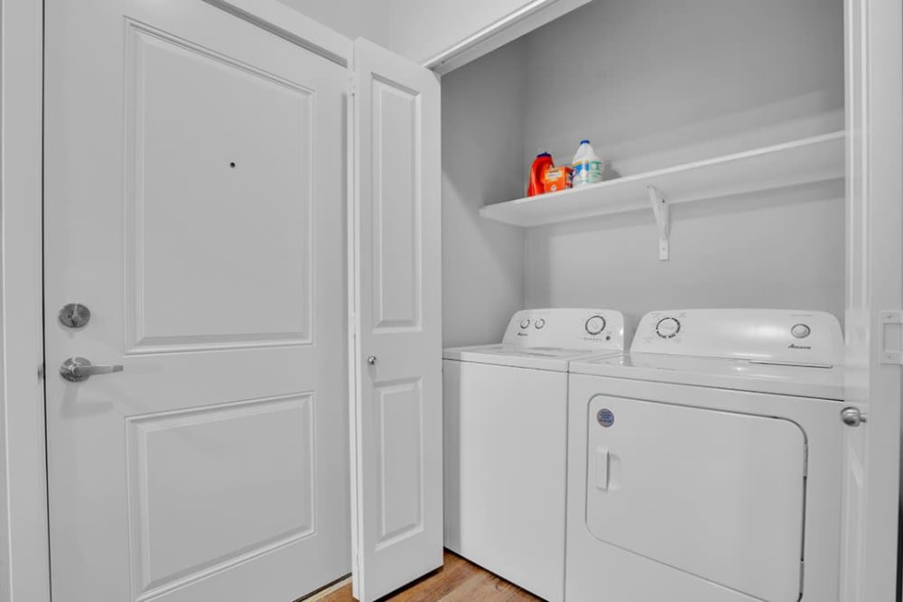 In-home laundry area with washer, dryer at Cleveland Crossings in Woodburn, Oregon