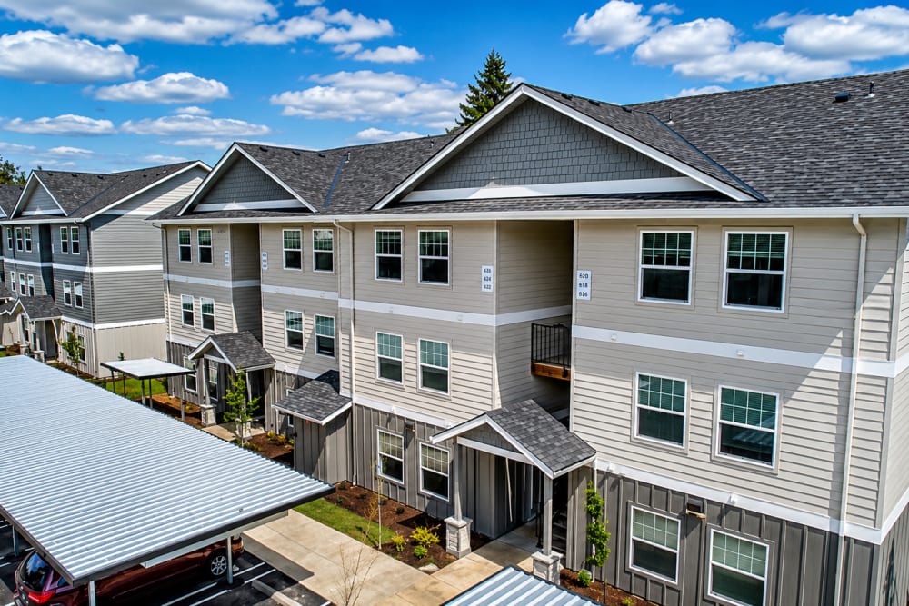 Aerial view of contemporary apartment residences and covered parking, Cleveland Crossings in Woodburn, Oregon