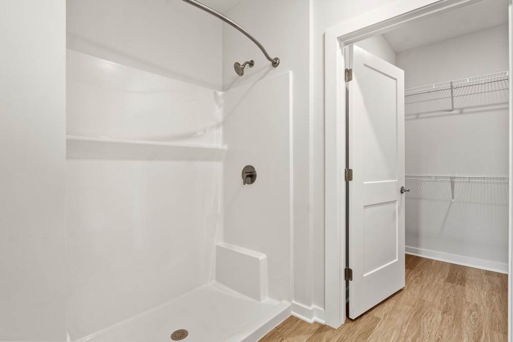 Spacious bathroom with vanity, storage, and bright lighting at The Cascade at Foundry Creek in Richmond, Virginia