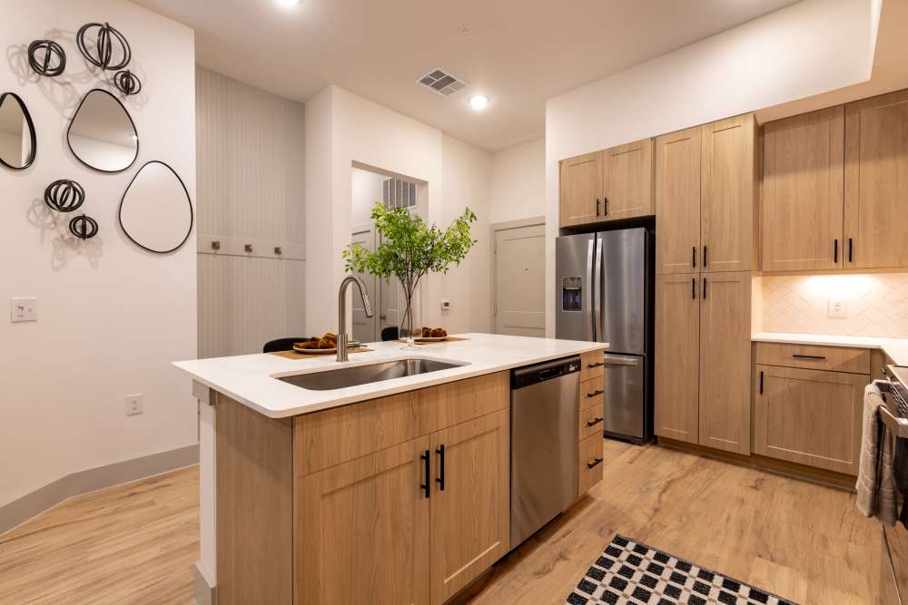 Spacious kitchen with island and stainless steel appliances at Winston Heights in Houston, Texas.