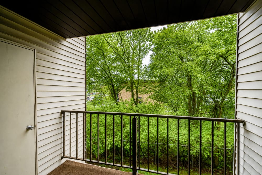 Private apartment balcony overlooking trees at Carriage Court in Cincinnati, Ohio