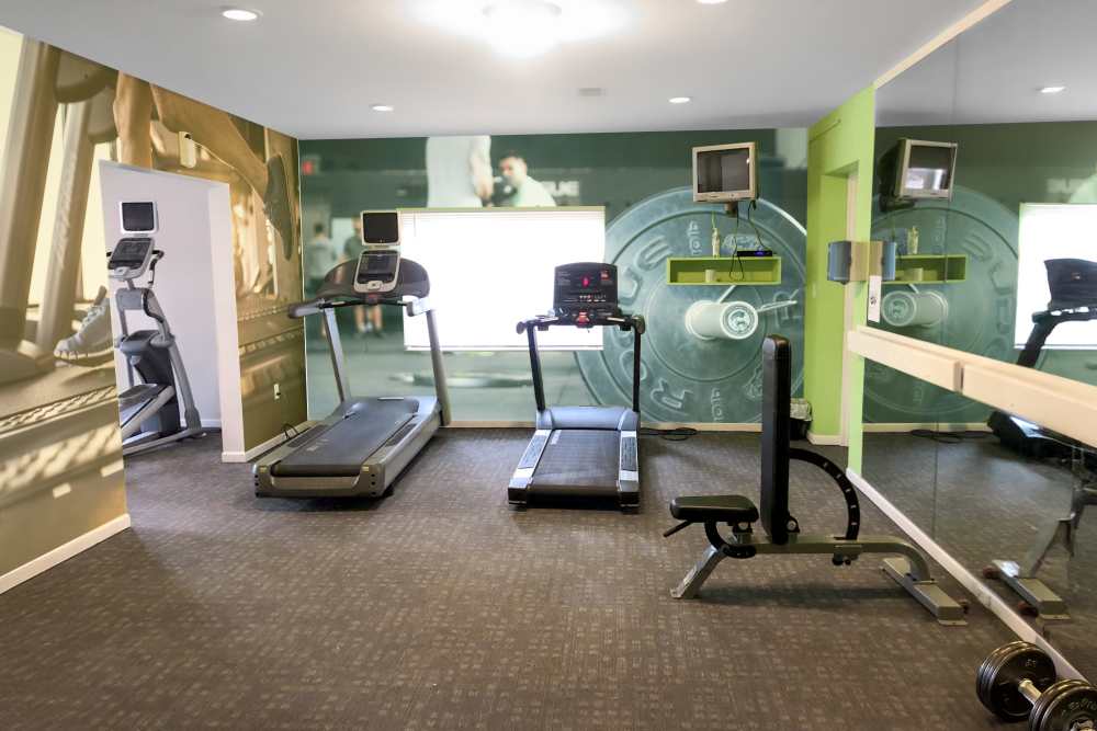 Fitness center with treadmills and strength equipment at Carriage Court in Cincinnati, Ohio