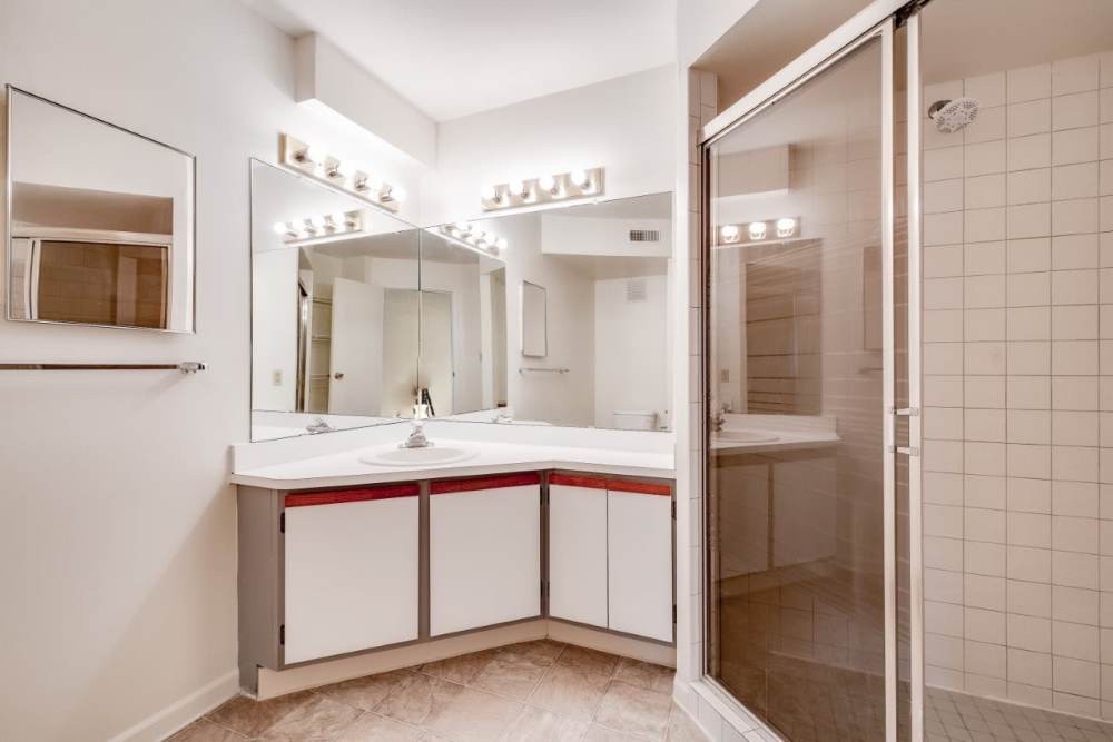 Bathroom with corner vanity and glass shower at Carriage Court in Cincinnati, Ohio