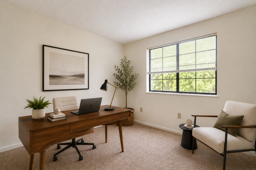 Home office with large window and natural light at Carriage Court in Cincinnati, Ohio