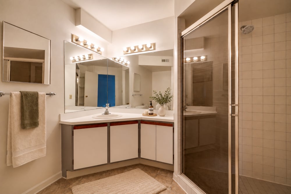 Bathroom with corner vanity and glass shower at Carriage Court in Cincinnati, Ohio
