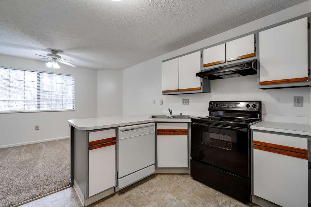 Staged apartment kitchen and dining area at Carriage Court in Cincinnati, Ohio