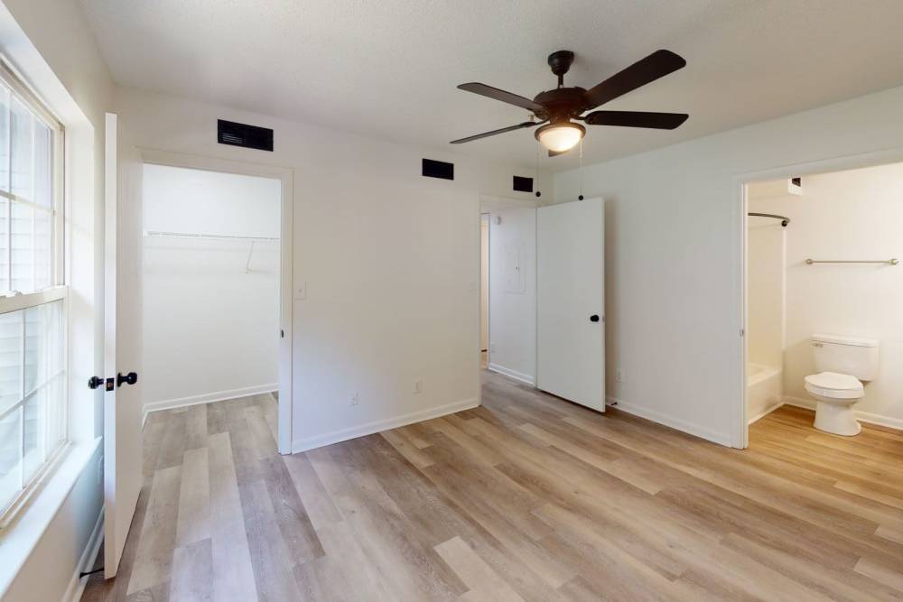 Bedroom with attached patio at Wallace Terrace Apartments in Charlotte, North Carolina