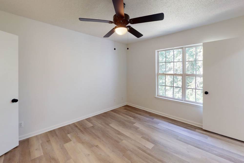 Bedroom with ceiling fan at Wallace Terrace Apartments in Charlotte, North Carolina