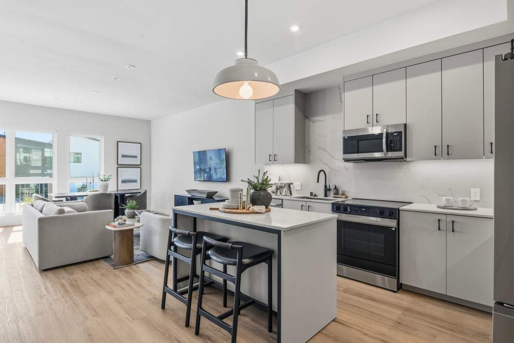 Expansive kitchen with an island and stainless-steel appliances at Haven and Arrow in Rancho Cucamonga, California