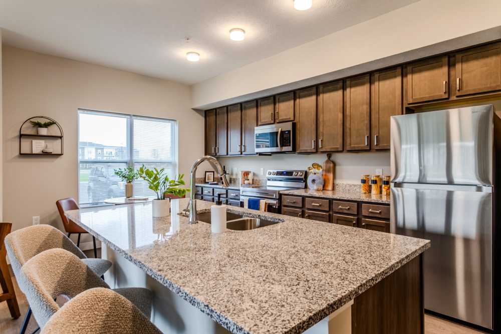 Kitchen with cabinet and energy-efficient appliances at Buckstone Flats in Obetz, Ohio