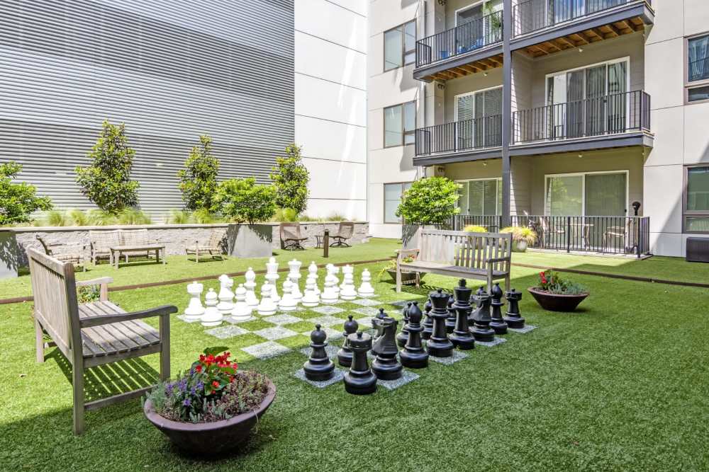 Giant chess set on artificial grass at The Residences at Town Center in Virginia Beach, Virginia