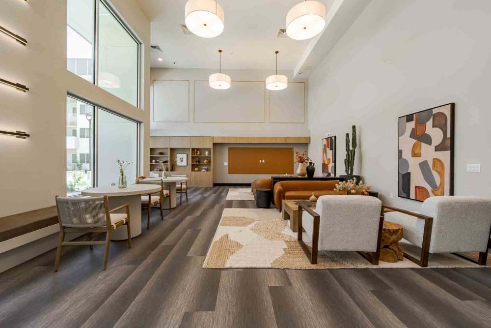 Clubhouse with lounge chairs at Waterman Senior Apartments in Maricopa, Arizona