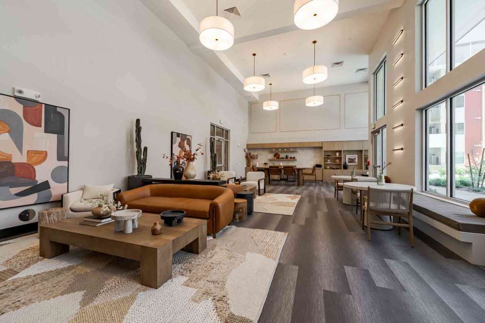 Clubhouse with lounge chairs at Waterman Senior Apartments in Maricopa, Arizona