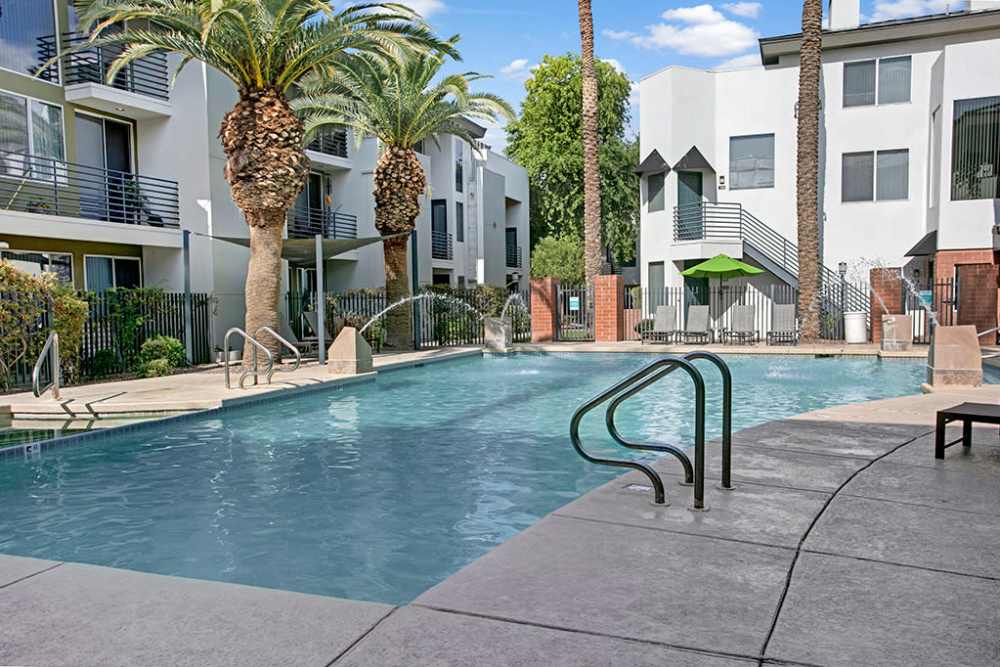 Outdoor swimming pool with crystal clear water at Dryden in Phoenix, Arizona