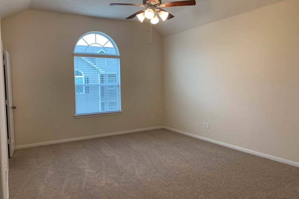 Ceiling fan spins in empty room at 36 Palms Townhomes in Missouri City, Texas