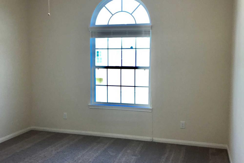 Light-colored walls with a large window at 36 Palms Townhomes in Missouri City, Texas