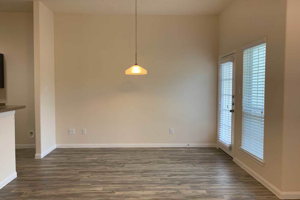Hanging light fixture above a floor space at 36 Palms Townhomes in Missouri City, Texas