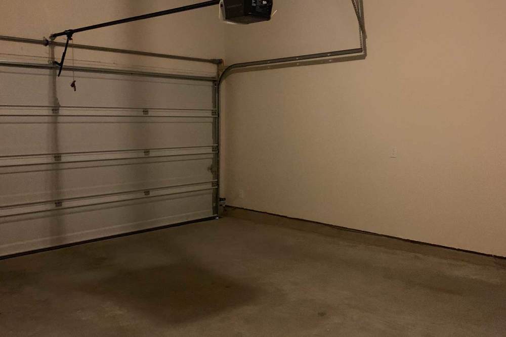 Garage door with open mechanism at 36 Palms Townhomes in Missouri City, Texas