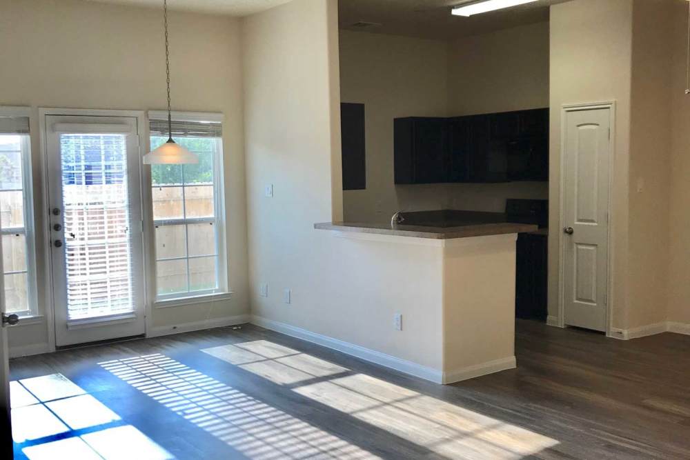 Light streams through windows and door at 36 Palms Townhomes in Missouri City, Texas