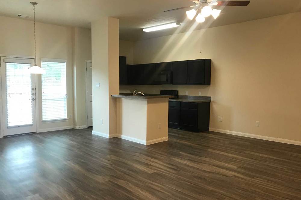 Light fixture hanging above kitchen island at 36 Palms Townhomes in Missouri City, Texas