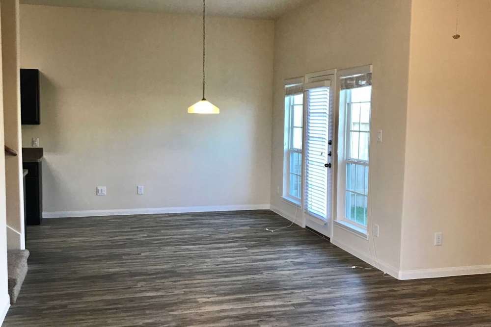 Wooden flooring with large windows at 36 Palms Townhomes in Missouri City, Texas