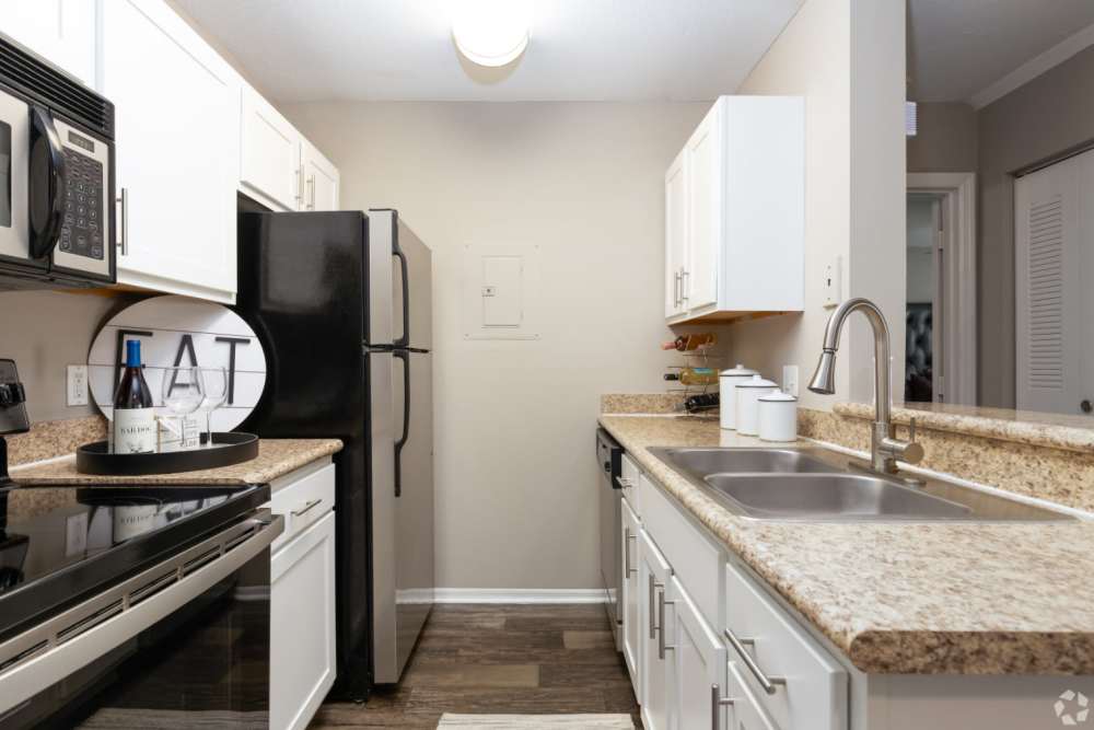 Open layout kitchen with granite countertops at Highpoint Club in Orlando, Florida