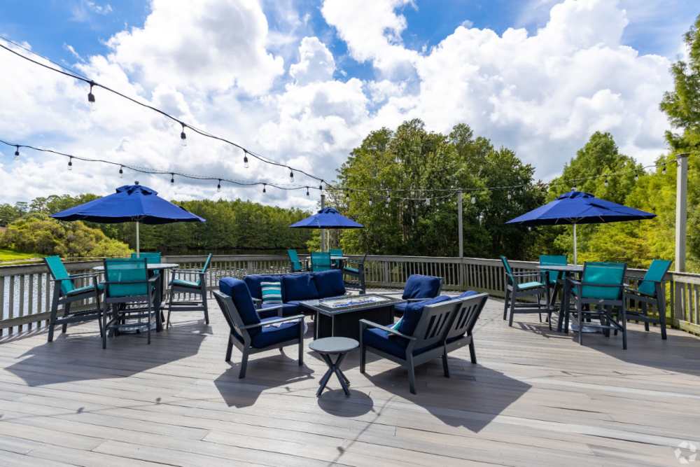 Inviting outdoor seating area with umbrellas at Highpoint Club in Orlando, Florida