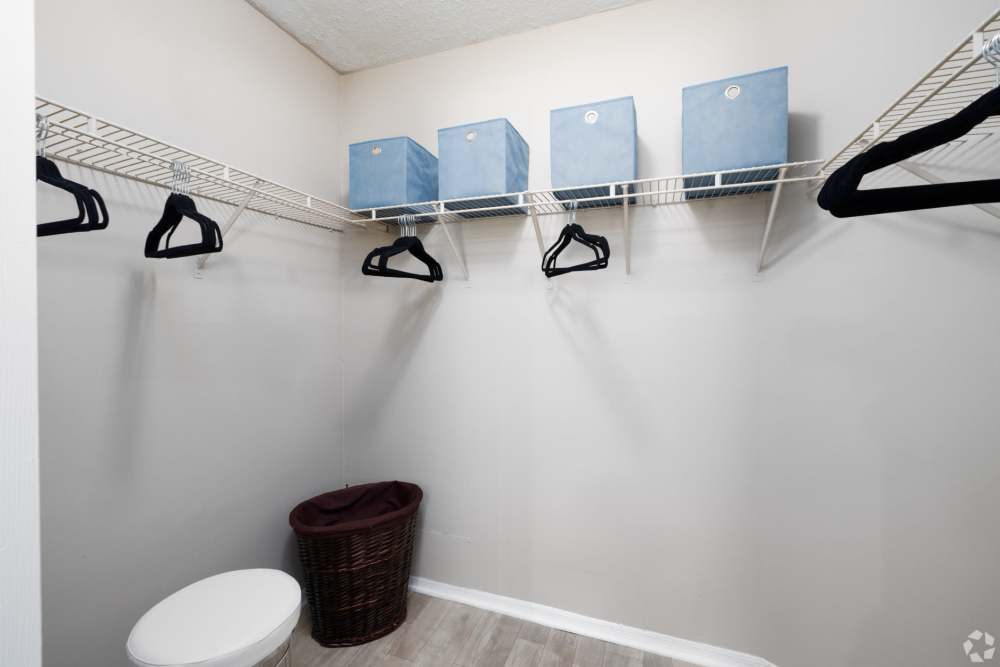 Spacious closet with shelving and storage boxes at Highpoint Club in Orlando, Florida
