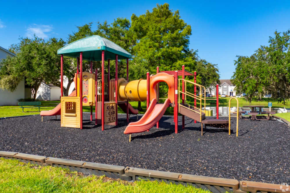 Playground equipment with slides and climbing structures near Highpoint Club in Orlando, Florida