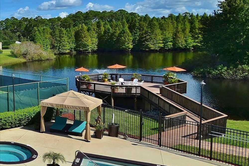 Resort-style pool and deck at lakefront at Highpoint Club in Orlando, Florida