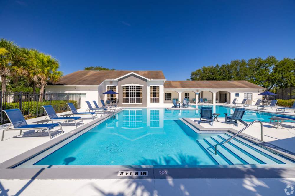 Sparkling pool with lounge chairs at Highpoint Club in Orlando, Florida